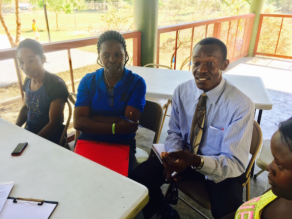 A meeting of the Volunteer Parent Committee (committee chair, center).